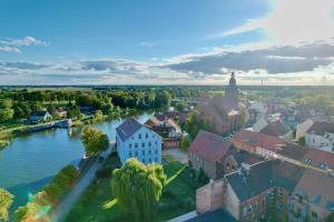 an aerial view of a town next to a river at Das BilderbuchCafe - Ferien - Apartment NO 3 - Markt 7 in Havelberg