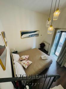Postel nebo postele na pokoji v ubytování Vicolo III Triggio + 11 fotografií