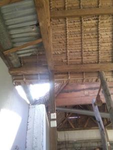 a roof of a building with a wooden ceiling at L'ami HOTEL in Antalaha