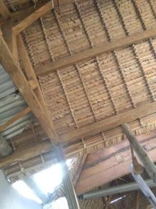 an overhead view of a wooden ceiling in a building at L'ami HOTEL in Antalaha