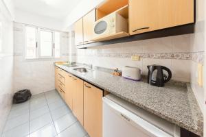 Le Batiment Apartments的厨房或小厨房