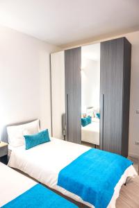 Postel nebo postele na pokoji v ubytování Gavirate Lake apartment