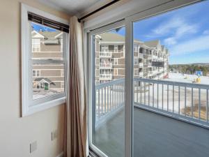 a balcony with a view of a condo at ML310 1BR 1BA WiFi Budget Friendly Next To Slopes in Snowshoe +2 photos