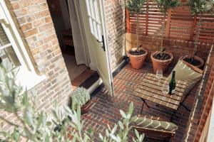 an open door with a bunch of potted plants at Leworth Apartments, Windsor in Windsor