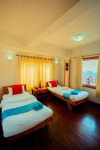Postel nebo postele na pokoji v ubytování Kathmandu View Hotel + 37 fotografií