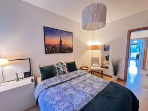 a bedroom with a large bed and a living room at Lisbon Room S Joao Talha in São João da Talha