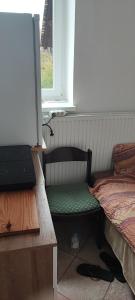 Posezení v ubytování SOSTANJ VELENJE RAVNE SOBE ROOMS Vrtacnik d o o