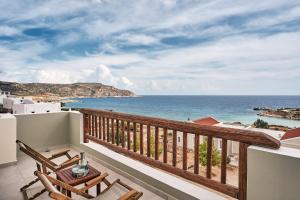 a balcony with chairs and a view of the ocean at Althea Boutique Hotel - Adults Only in Amoopi