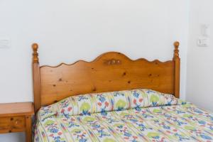 A bed or beds in a room at Hotel Amic Can Pastilla