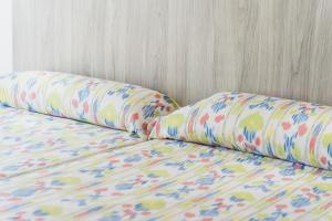 A bed or beds in a room at Hotel Amic Can Pastilla