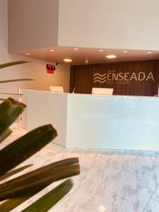 a conference room with a sign in the background at Hotel Enseada Boa Viagem in Recife