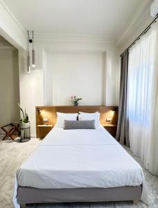 Postel nebo postele na pokoji v ubytování OIKO MINI SUITES