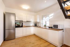 Kuchyň nebo kuchyňský kout v ubytování House Jurica