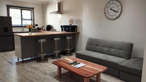 a living room with a couch and a table at DINAS Self-Catering Accommodation Flat 2 in Oranjemund