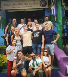a group of people posing for a picture on a slide at The Funky Monkey Hostel - 18 to 40 years old only in Haad Rin
