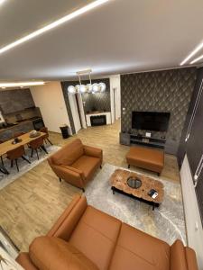 a living room with a couch and a table at Village Relax House in Čerević