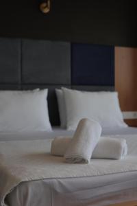 Postel nebo postele na pokoji v ubytování Taşliman Otel