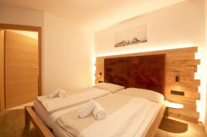 Posteľ alebo postele v izbe v ubytovaní Alpin & Seeresort Top 14 - by Alpen Apartments