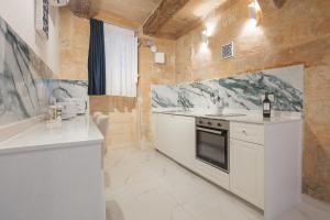 Kuchyň nebo kuchyňský kout v ubytování Vallettastay Classic Apartments + 45 fotografií