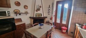 Kuchyň nebo kuchyňský kout v ubytování Casa Alessandro + 37 fotografií