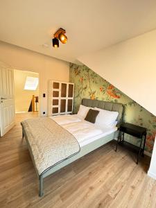 Uma cama ou camas num quarto em Carl von Rosé