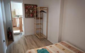 a bedroom with a bed and a ladder in a room at Chez Karine à Lencouacq in Lencouacq
