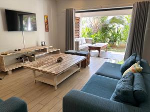 Posezení v ubytování Au cœur de Tamarin entre Rivière et Mer -Magnifique appartement 3 chambres- Calme et nature