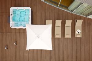 a wooden wall with a white paper and a clock at Radisson Blu Resort & Spa in Split