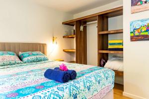 a bedroom with a bed with a blue towel on it at J&L Resort in Willemstad +123 photos