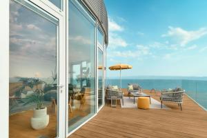 a balcony with a view of the ocean from a house at Radisson Blu Resort & Spa in Split