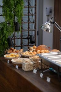 a buffet of bread and pastries on a table at H2 Platinum Lourdes in Belo Horizonte