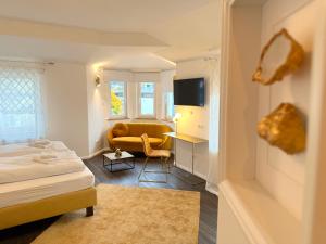 Postel nebo postele na pokoji v ubytování Hotel Villa WUN
