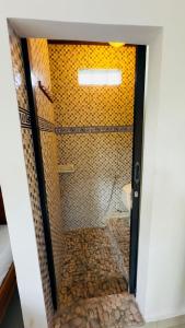 a bathroom with a shower with a toilet in it at Surya Ubud View and Suites by EPS in Ubud
