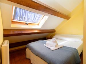 Postel nebo postele na pokoji v ubytování Apartamentos Canfranc 3000