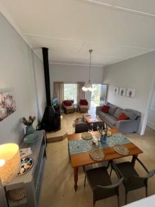 a living room with a table and a couch at Valley View Cottage Unit 8 Hilltop Farm in Rosetta