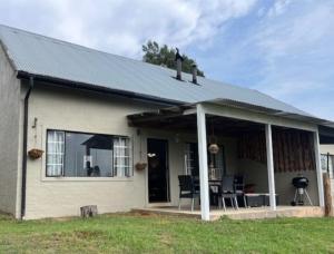 a house with a pitched roof and a patio at Valley View Cottage Unit 8 Hilltop Farm in Rosetta +9 photos