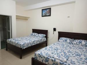 Postel nebo postele na pokoji v ubytování Hotel JIRA