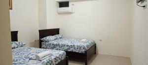 Postel nebo postele na pokoji v ubytování Hotel JIRA