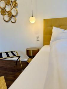 Postel nebo postele na pokoji v ubytování Hotel Villa WUN