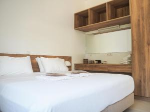 Postel nebo postele na pokoji v ubytování Trinity Urban Residences Plumeria