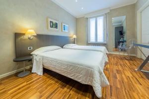 Postel nebo postele na pokoji v ubytování Century Hotel