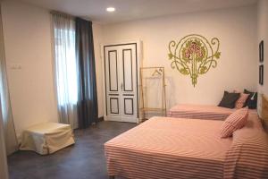Postel nebo postele na pokoji v ubytování CASABONA1910 bed&breakfast