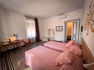 Postel nebo postele na pokoji v ubytování CASABONA1910 bed&breakfast
