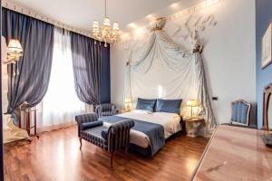 Postel nebo postele na pokoji v ubytování Hotel Impero