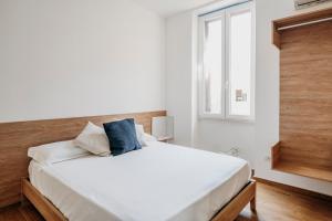 Postel nebo postele na pokoji v ubytování DimoraArsenale