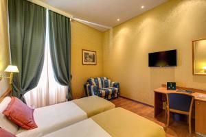 TV a/nebo společenská místnost v ubytování Hotel Impero