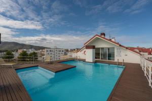 a swimming pool on the roof of a building at Casa2Iberia in Benissa