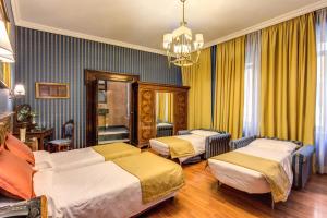 Postel nebo postele na pokoji v ubytování Hotel Impero