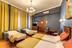 Postel nebo postele na pokoji v ubytování Hotel Impero + 33 fotografií