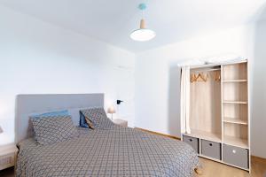 a bedroom with a bed and a book shelf at Maison de vacances in Sarlat-la-Canéda